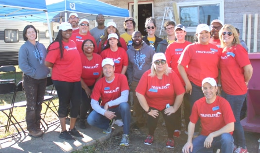 Travelers employees participate in a local build with SBP