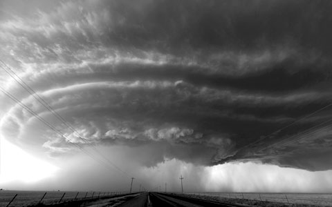 Black and white storm cloud over a large plain