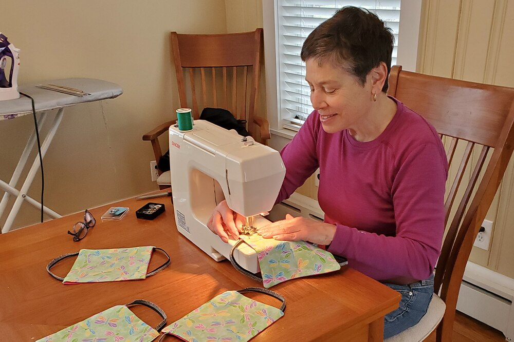 woman sewing face masks