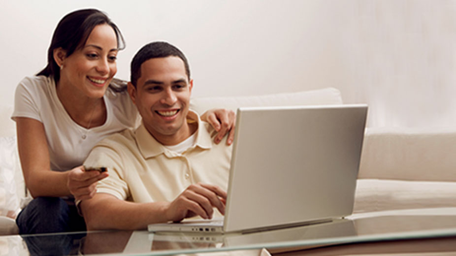 man and woman working on a laptop