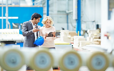 man and women looking at clipboard