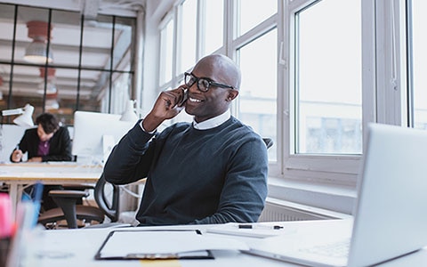 man on phone near window