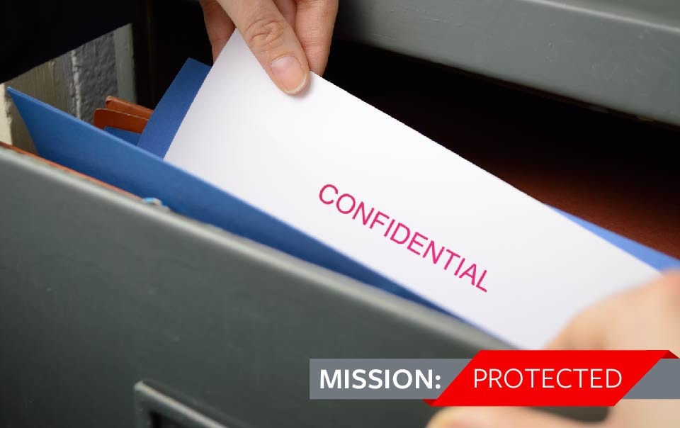 Person taking out confidential file from drawer