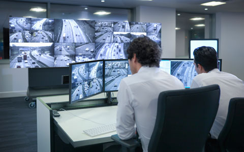 person looking at monitors as part of smart city public safety