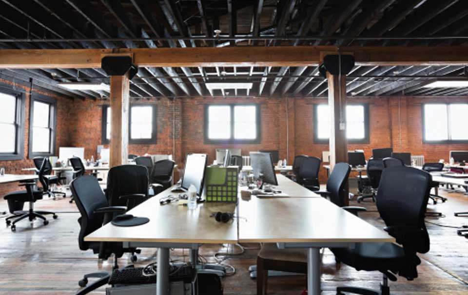 empty chairs and tables in an office loft, Tips to Help Address the Impact of Unexpected Property Shutdowns