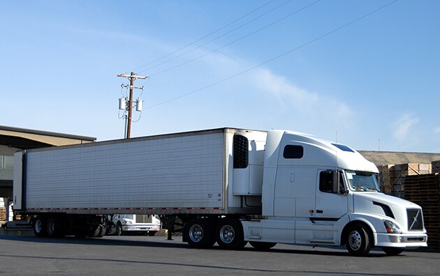 Truck leaving garage