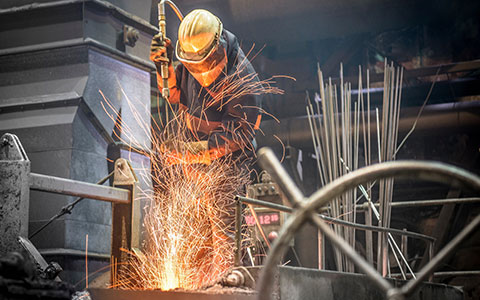 manufacturer working on site experiencing chronic pain