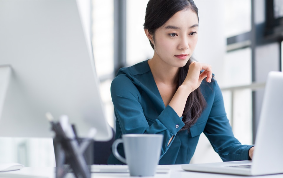 Woman looking at laptop