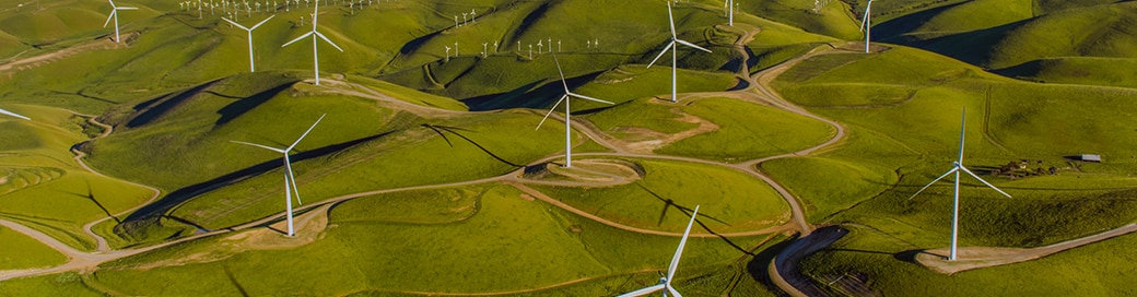 wind farm on green hills