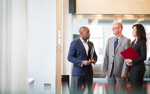 three professionals talking about general liability