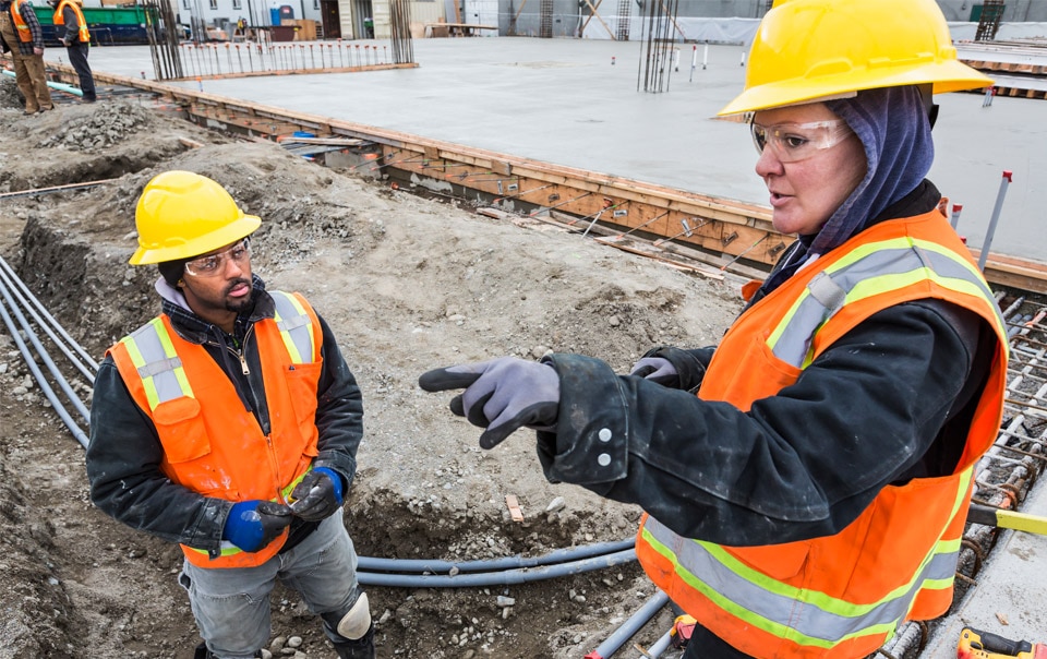 Utility contractors working on construction site