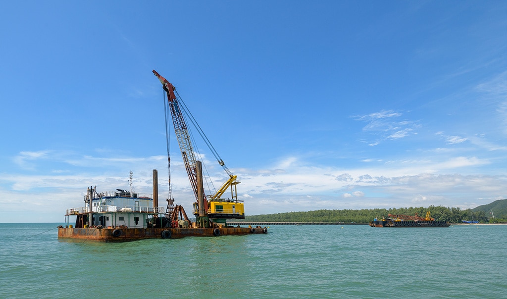 Crane on a barge of a marine construction site