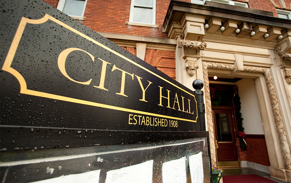 building with a city hall sign, Risk Control Considerations for Public Entities During and After the COVID-19 Pandemic