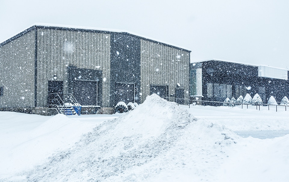 snow falling on commercial building