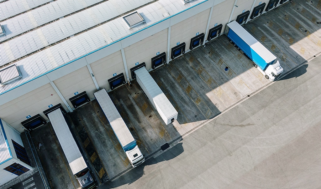 Semi-trucks parked at transportation hub