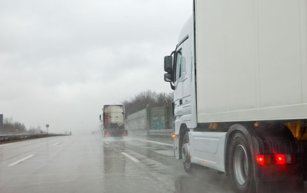 Truck driving in the rain