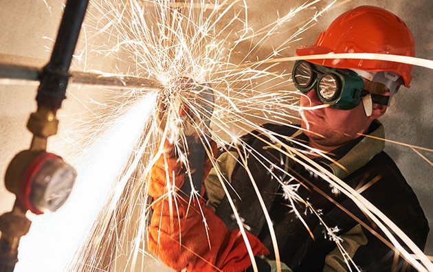 Person welding on a construction site