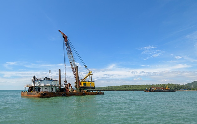 Crane on a barge of a marine construction site