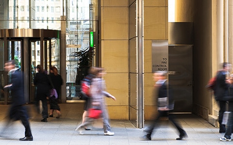 People walking outside of a business