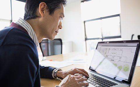 person checking computer for intellectual property