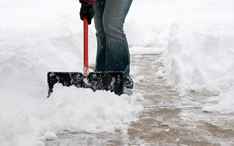 A person shoveling outside