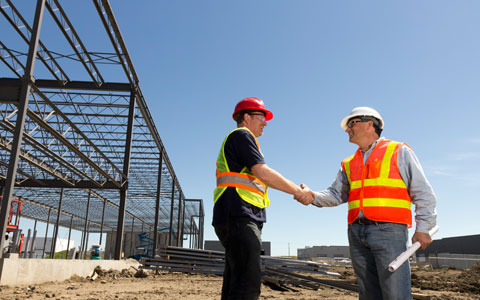 construction site contractor meeting with subcontractor