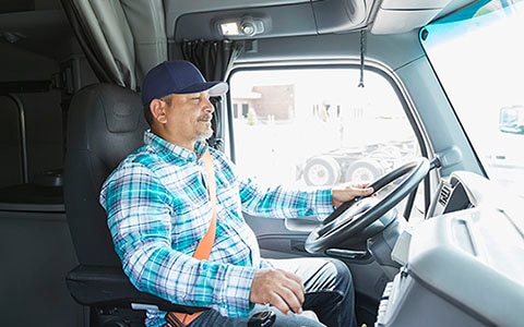 man driving a large commercial vehicle
