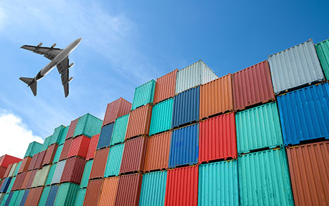 plane flying over cargo