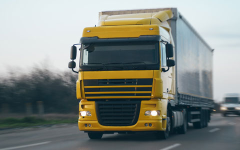 Car carrying cargo driving on road