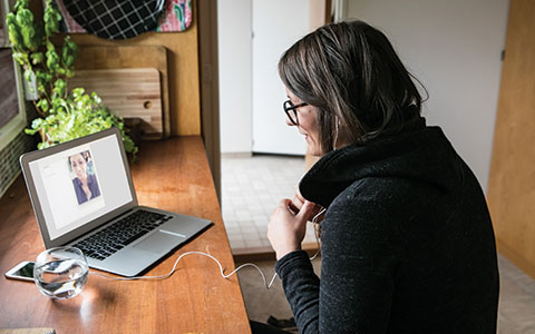 woman at desk on video call