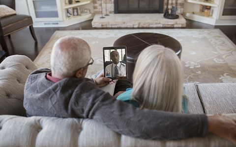 man woman sitting on couch video chatting on tablet, How to Market Your Business Online, Digital Marketing and Sale