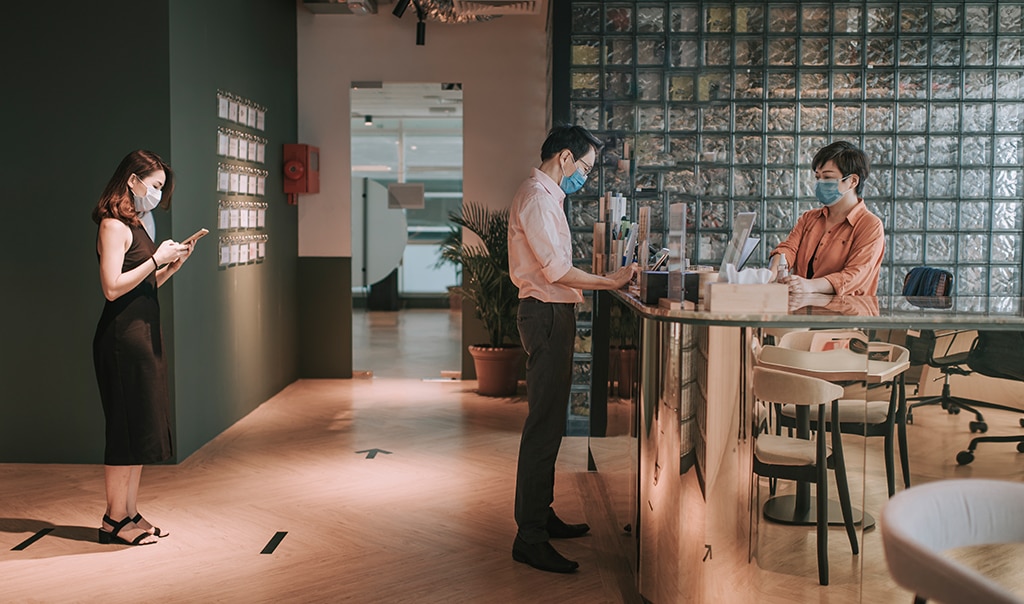 Business owner handling the checkout of a customer via a contactless payment