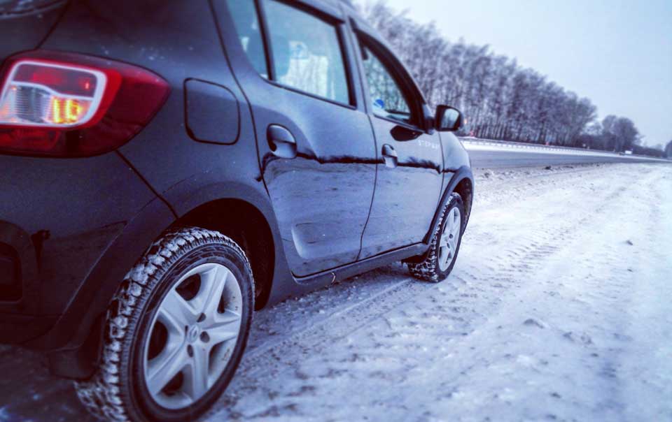 Car driving on wintry road