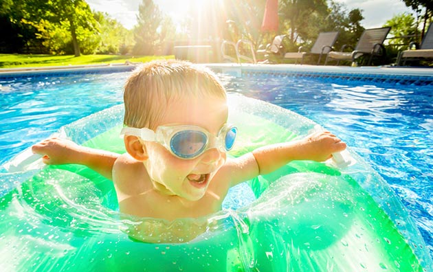 child in an inner tube in swimming pool