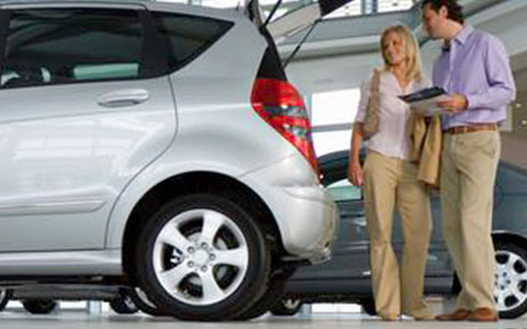 Couple shopping for a new car