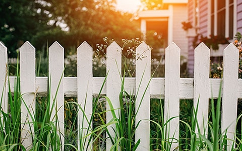 White picket fence between houses