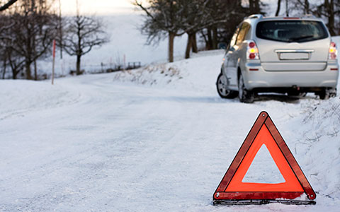 Car on the side of road in winter