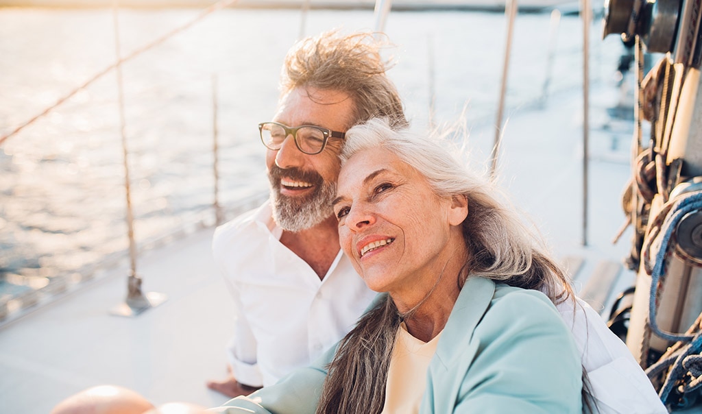 smiling couple on vacation on a boat