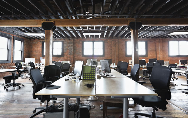 Empty open office with empty desks and chairs