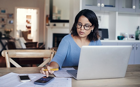 woman researching ways to save on car insurance