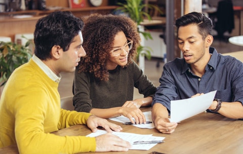 Couple of renters asking insurance representative about renters nsurance