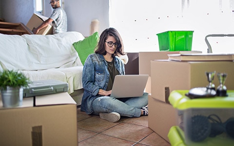 Renter sitting on floor of aparment